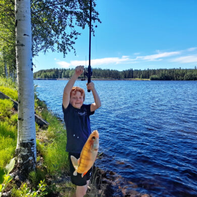 Girl Fishing on a Riverbank